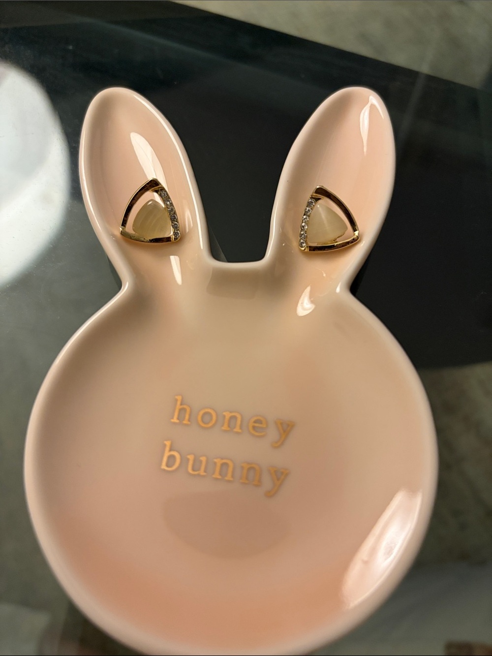 Gold Triangle Crystal Stud Earrings on Pink Bunny Dish